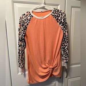 Small orange with leopard print sleeves/ long sleeve shirt